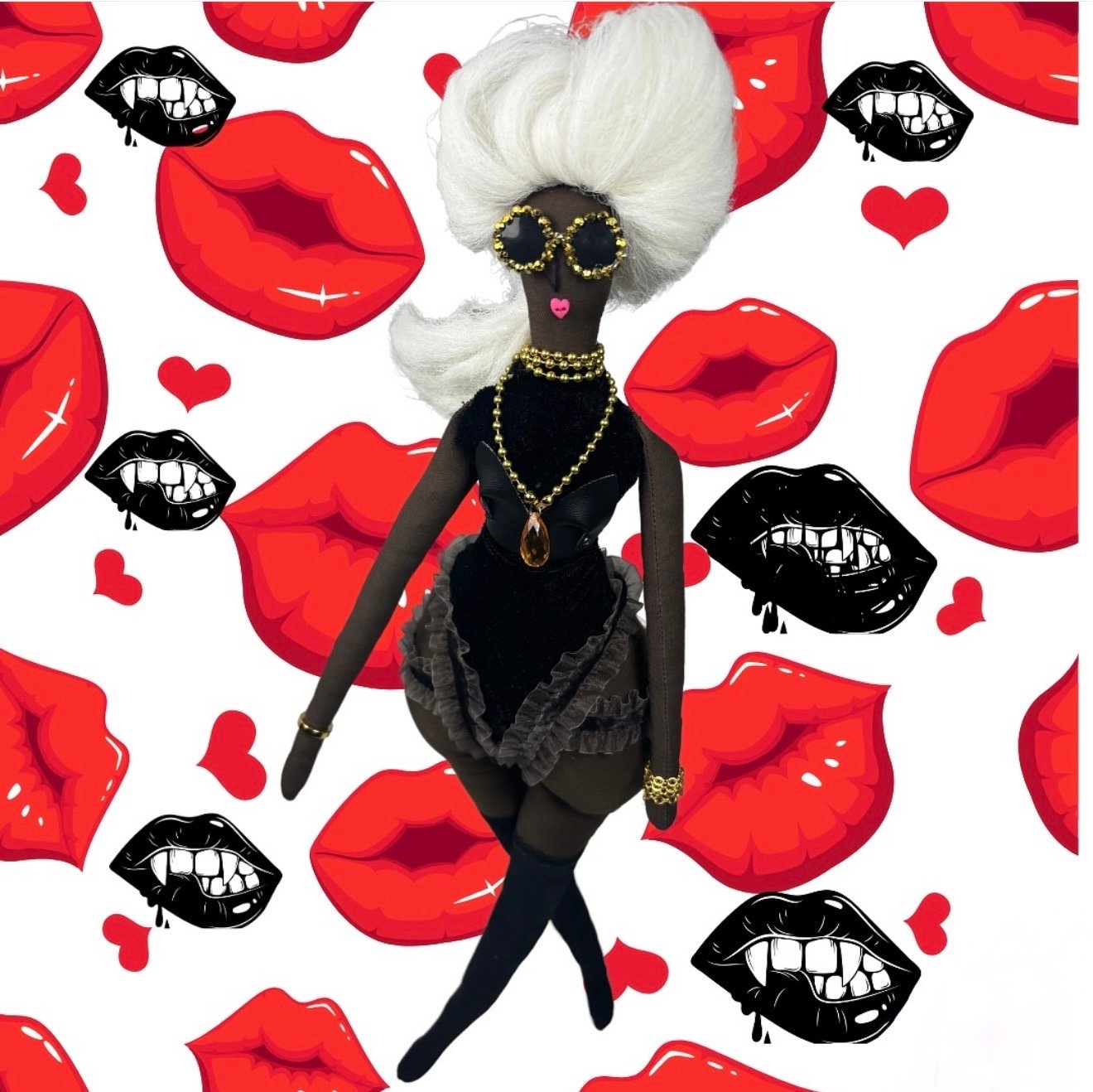 Mello Doll with white hair, black dress, and gold accessories